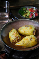 Delicious golden chicken accompanied by colorful salad and rustic utensils