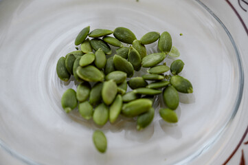 pumpkin seeds on a plate — close-up