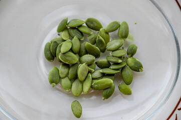 pumpkin seeds on a plate — close-up
