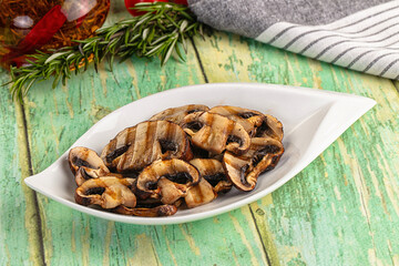 Tasty hot grilled champignon mushrooms