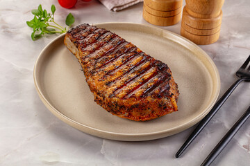 Grilled pork steak with bone