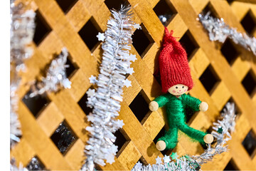 Christmas decorations. Tinsel, small wooden tree, and figurines for Christmas decorations.