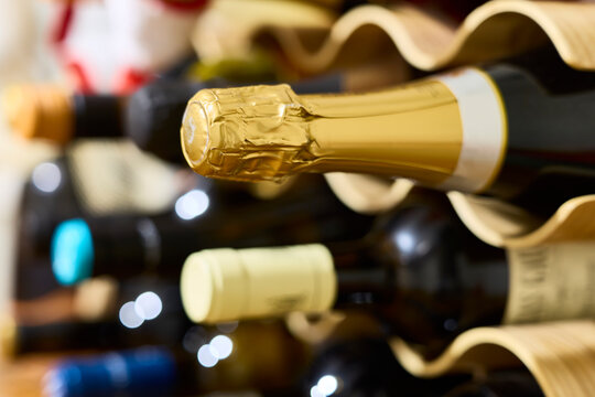 Bottle rack. Bottles of champagne and wine in a bottle rack.