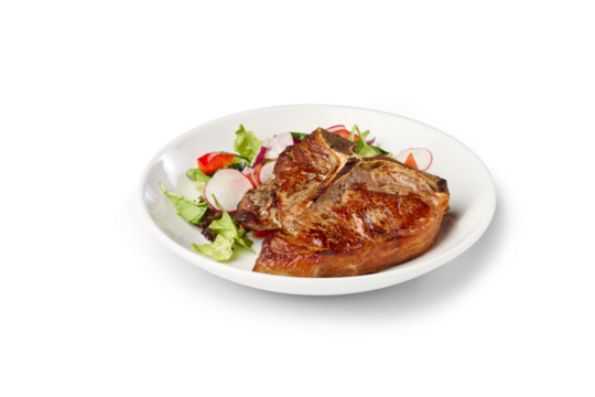 Grilled t-bone steak serving a healthy high-protein dinner with fresh vegetables on white