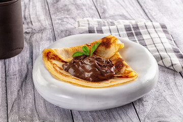 Sweet pancake with chocolate paste
