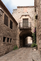 Peratallada stone archway alley in medieval village