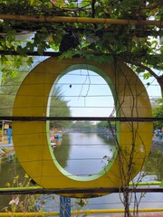 Naklejka premium View of the tourist lake from an O shape window.