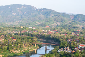 Luang prabang city overview with nam khan river bridge