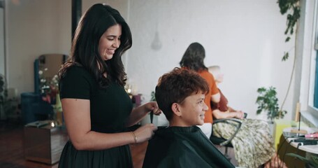 Salon, hairdresser and child with cape, haircare and hair maintenance with equipment or consultation. Hairstylist, appointment and woman with boy for haircut, grooming and process for hairstyle