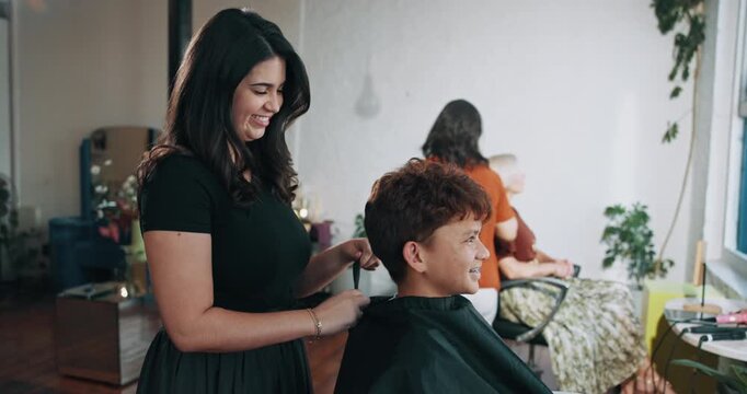 Salon, hairdresser and child with cape, haircare and hair maintenance with equipment or consultation. Hairstylist, appointment and woman with boy for haircut, grooming and process for hairstyle