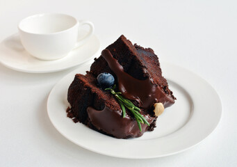 Dark Chocolate Cake. Tender, moist homemade chocolate cake with the best smooth, rich, dark chocolate frosting, decorated fresh blueberry and rosemary twig