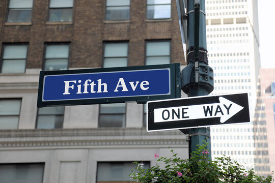 Traffic sign Fifth Avenue arrow ONE WAY street New York City - Powered by Adobe