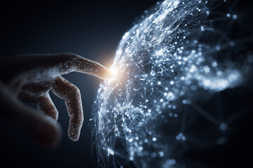 A hand is touching a globe with a light shining on it