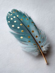 Close-up of a vibrant teal feather with golden spots