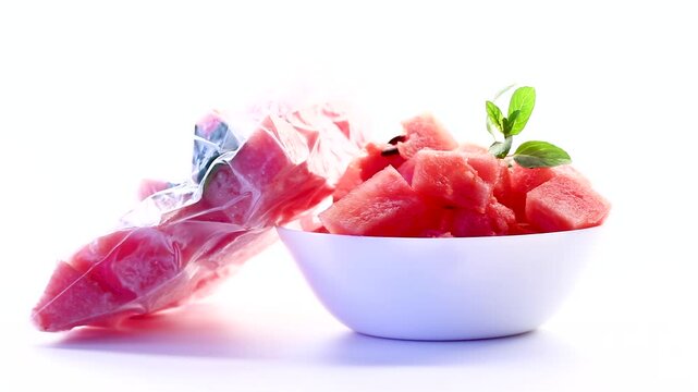frozen watermelon in a vacuum bag and fresh in a plate