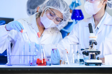 Fototapeta premium Biotech experts utilizing AI-driven genomic sequencing for molecular analysis in smart lab, optimizing high-throughput drug discovery workflow and precision medicine for future health.