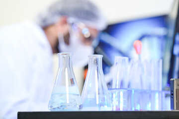 Biotech experts utilizing AI-driven genomic sequencing for molecular analysis in smart lab, optimizing high-throughput drug discovery and precision medicine workflow.