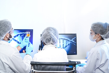 Biotech experts utilizing AI-driven genomic sequencing for molecular analysis in smart lab, optimizing high-throughput drug discovery and precision medicine workflow.