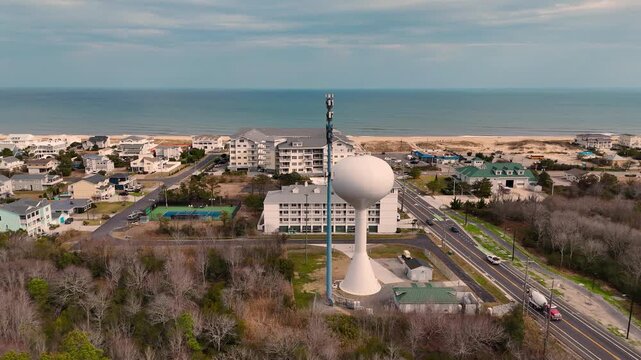 Cinematic Aerial Push-In on Water Tower and Communications Mast in Sandbridge, Virginia Beach