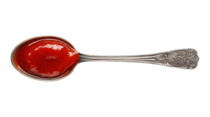 A spoonful of red sauce is shown, isolated on a transparent background