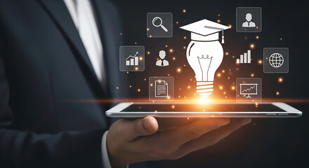 Businessman holding a tablet with a glowing lightbulb idea and educational icons symbolizing learning innovation and digital knowledge sharing in a modern business context