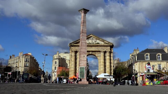 Arch and tower place in Victoire Bordeaux under blue sky