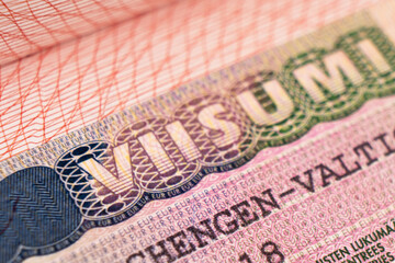 Schengen visa of Finland on the page of the passport. Part of suomi shengen visa close up