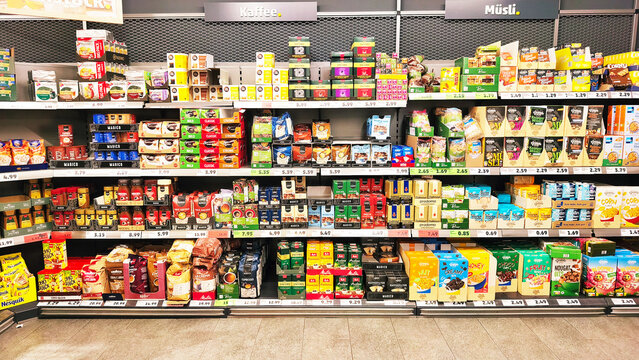 ISERLOHN, GERMANY &mdash; NOVEMBER 26 2025: supermarket shelves with assorted coffee and muesli products inside penny store today