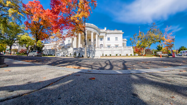 Autumn in the capital with historic architecture and vibrant leaves under blue sky