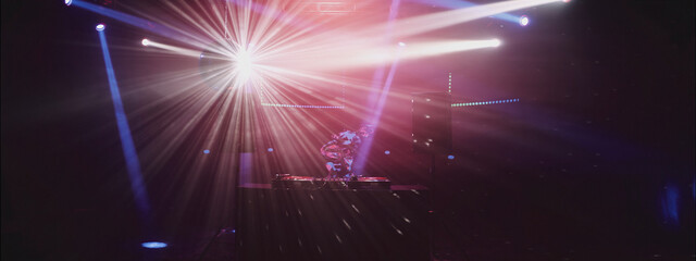 Bright lights and energetic beats create an electrifying atmosphere at the night club DJ event in the heart of the city