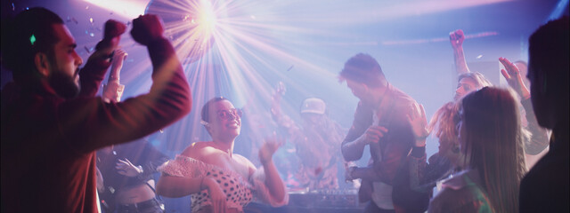 Vibrant dance party in a lively club featuring diverse crowd enjoying the music and atmosphere