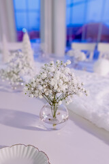 Delicate Baby's Breath Centerpiece on a Winter White Table
