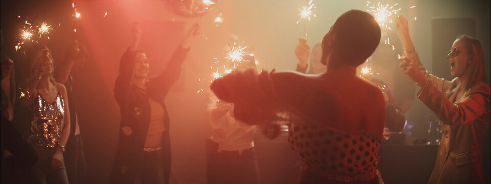 Sparkling celebration with friends in a vibrant atmosphere during a festive party