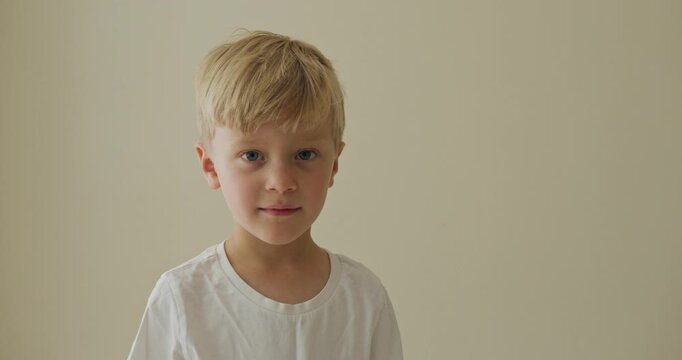 Young kid exploring softly illuminated, an ignorant youngster bathed in subtle illumination showing calm curiosity and innocent discovery