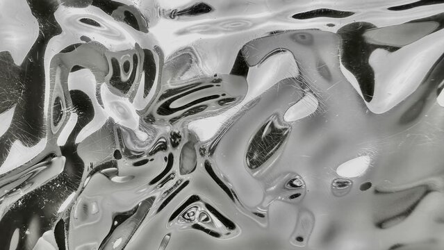 abstract liquid metal texture with wavy patterns bubbles and scratches in grayscale