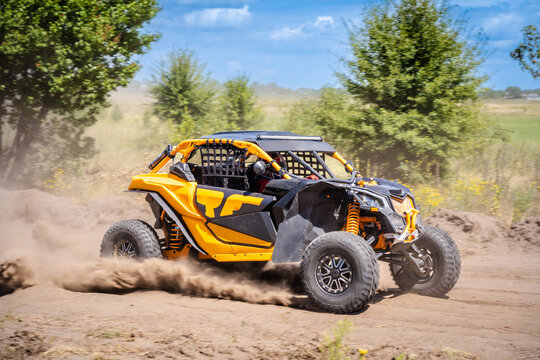 UTV buggy moves on dusty road. 4x4, extreme, adrenalin.
