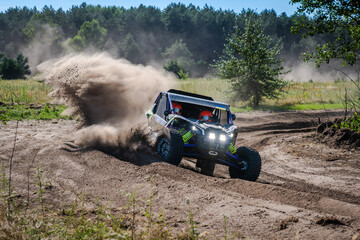 Fototapeta premium Cool view on UTV, rally, 4x4 riding in dusty track. Amateur competitions