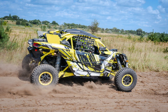 ATV, UTV, buggy, rally riding in dusty track. Amateur competitions