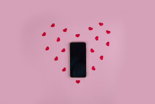 valentine themed flatlay with love elements, creative arrangement of hearts and mobile for romance content