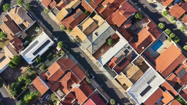 Aerial view shows rooftops and streets in a residential neighborhood area