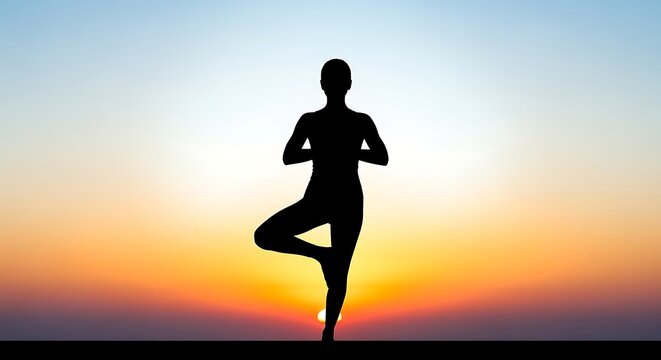 Silhouette of person in tree pose yoga against a vibrant sunset sky with gradient colors view