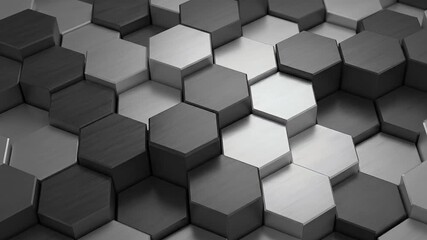A mesmerizing 3D abstract animation featuring an array of interconnected hexagonal shapes with a brushed metallic texture. The dark grey, light grey, and silver hexagons dynamically rise and fall in a - Powered by Adobe