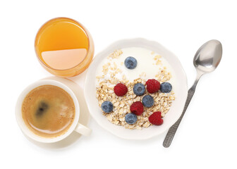 Tasty breakfast. Oat flakes with yogurt, berries, coffee and orange juice isolated on white, top view