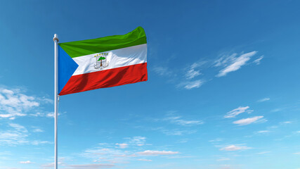 Equatorial Guinea flag waving under a clear blue sky, representing national sovereignty and pride