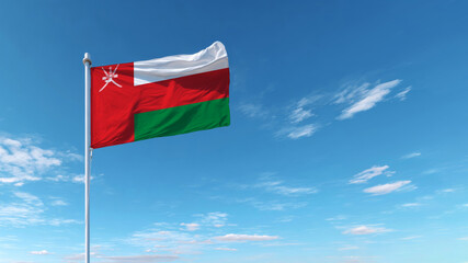 Flag of Oman waving proudly against a clear blue sky during a sunny day