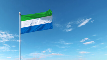 Celebrating Independence Day with the flag of Sierra Leone waving against a clear blue sky