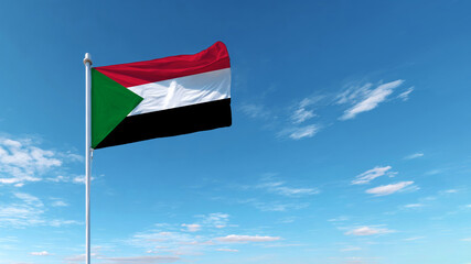 Sovereignty represented by the Sudanese flag waving under a bright blue sky