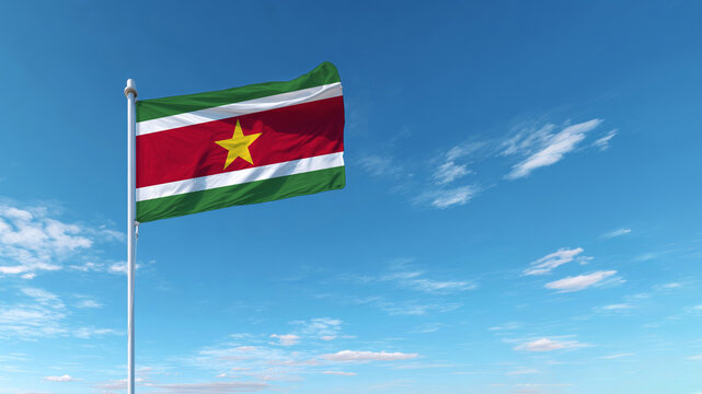 Celebrating Independence Day with the Suriname flag waving in a clear blue sky