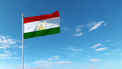 Celebrating independence day with the national flag of tajikistan against a clear blue sky