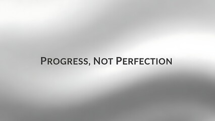 Progress not perfection text displayed on a blurred gradient background with light and dark shades
